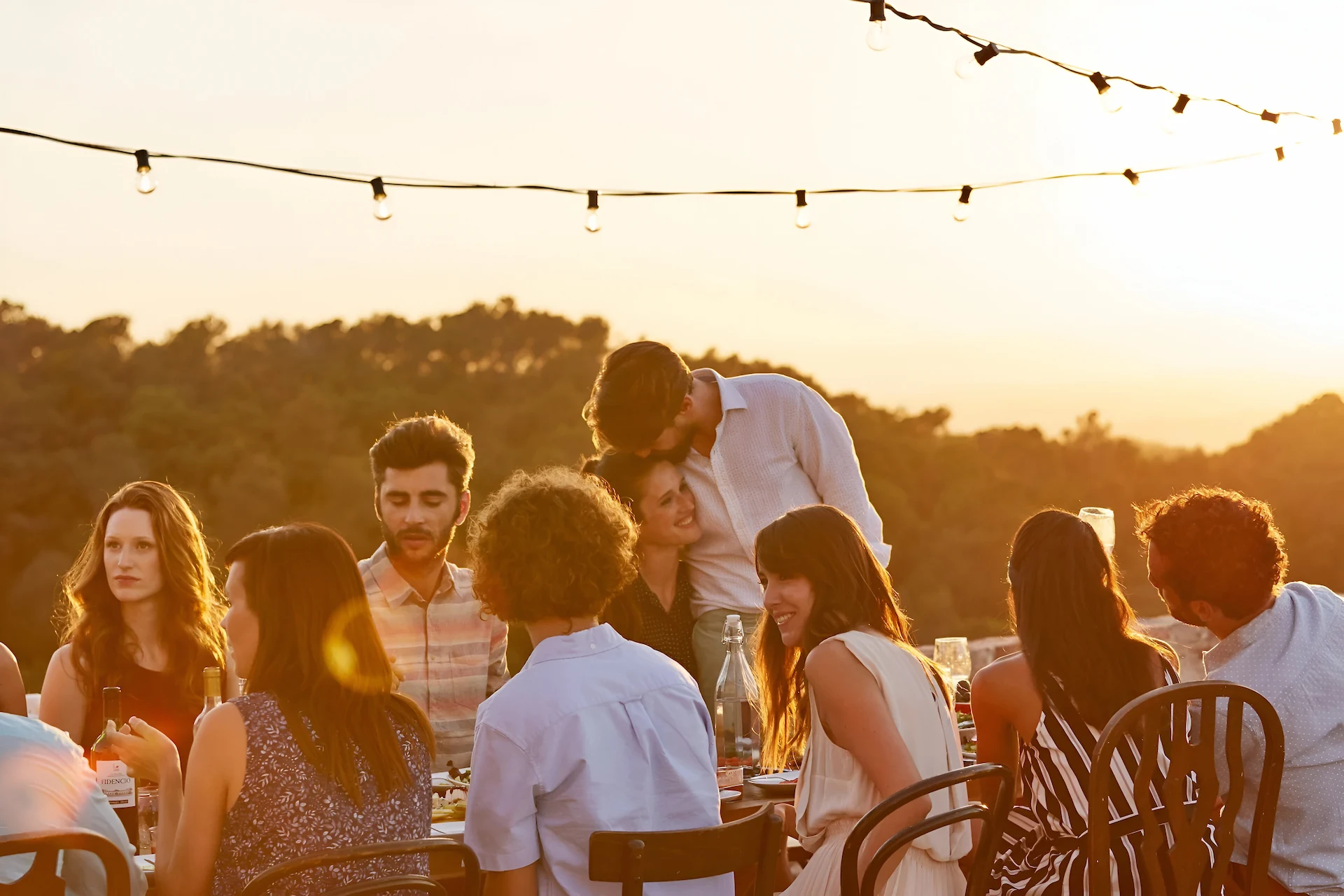 Meetings 1 Friends celebrating and toasting outdoors at sunset at The Sanderling Hotel – unforgettable dining experience
