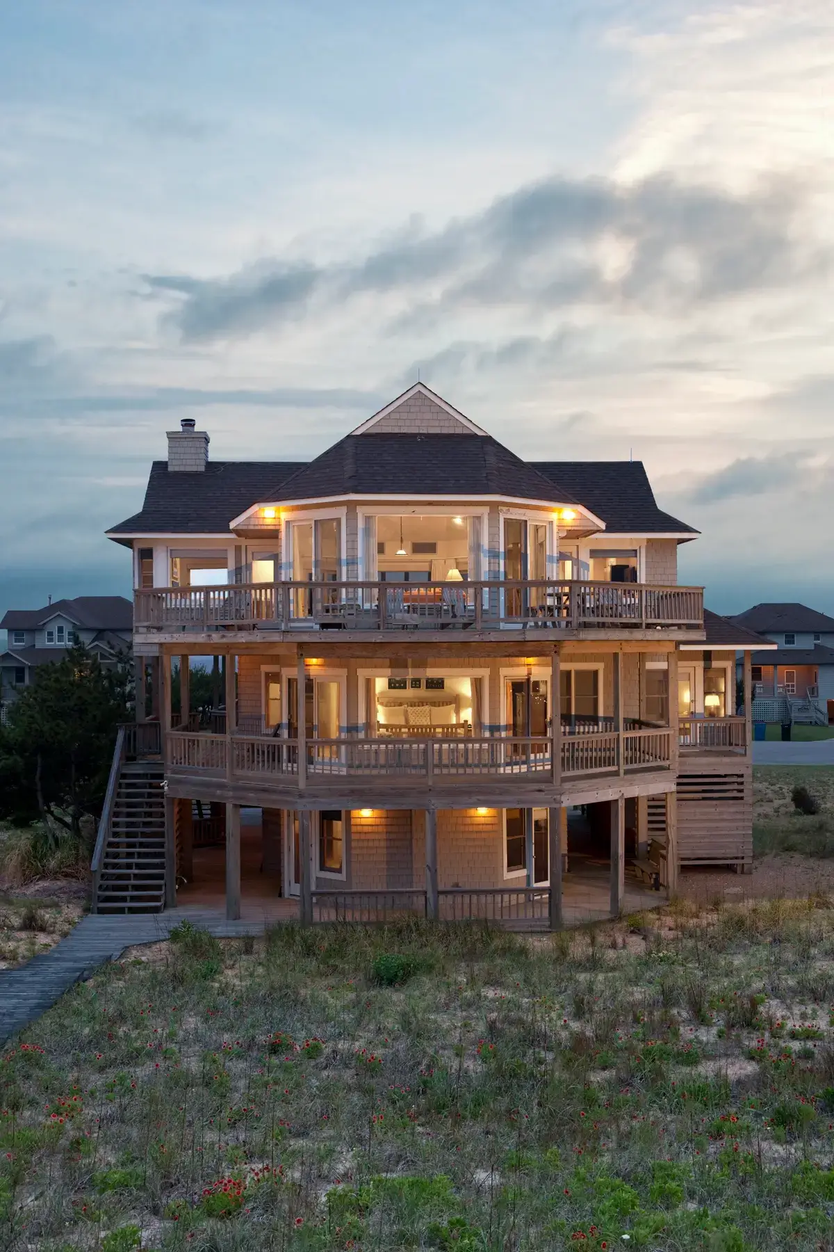Homepage 3 Front aerial view of Caffey House 6 Bedroom Residence at sunset.