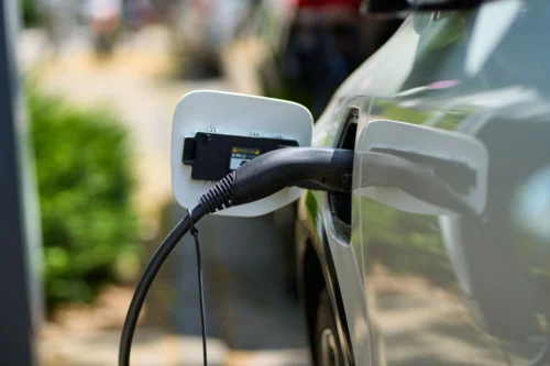 EV charging station powering an electric car at The Sanderling Hotel, eco-friendly convenience for modern travelers.