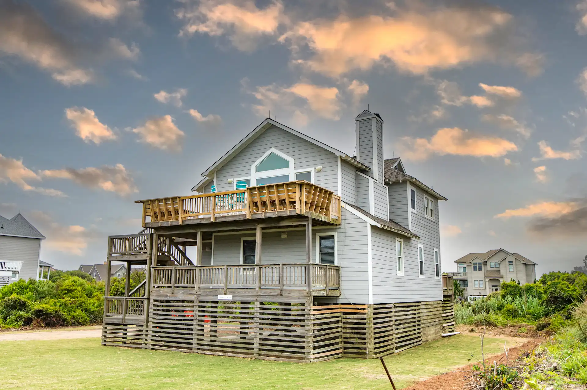 Exterior frontal view of the Sandpiper 4 Bedroom Residence surrounded by nature